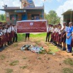 Creating awareness about waste disposal and cleanliness Students of The Orchids Public School & PU College standing in front of a temple during a cleanliness awareness drive