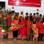 A vibrant display of tradition, creativity, and student talent Students dressed in colorful costumes for a cultural performance at The Orchids Public School